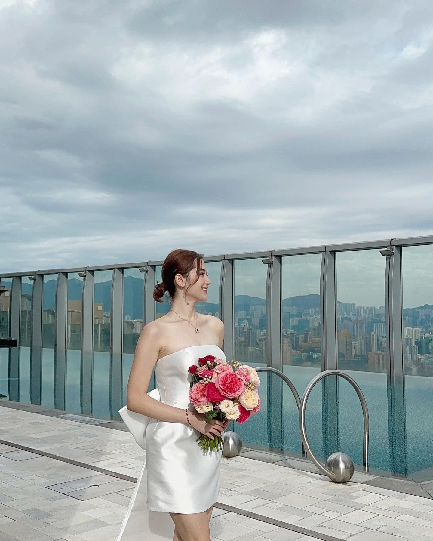 Bride with a lab-grown diamond pendant on a Hong Kong rooftop